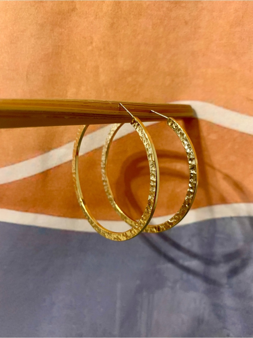 Flat hammered gold tone hoop earrings